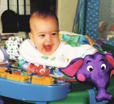 Cute baby girl with purple elephant